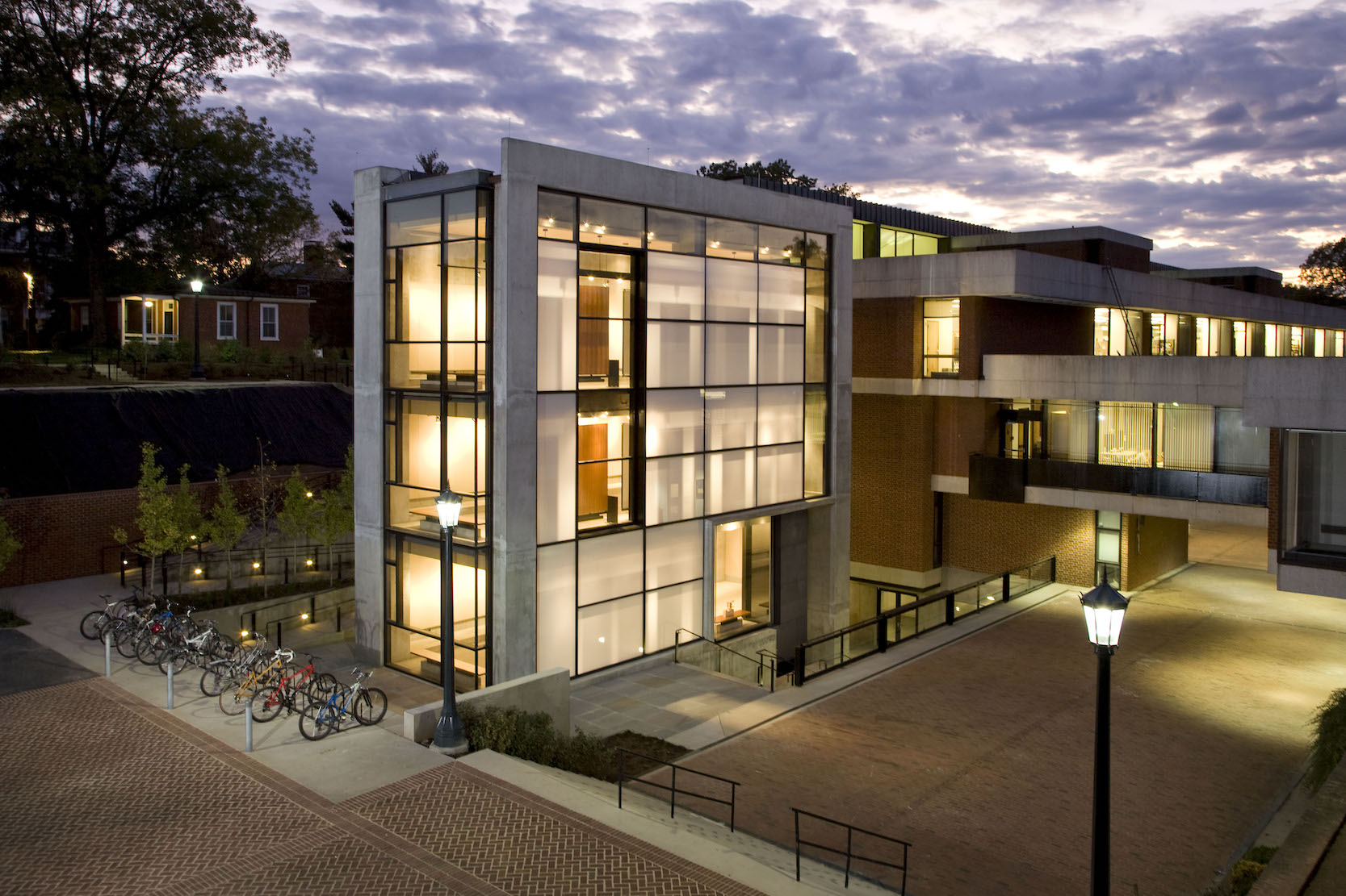 Nighttime exterior shot of Campbell Hall, an expansion of the School of Architecture at the University of Virginia, designed by W.G. Clark