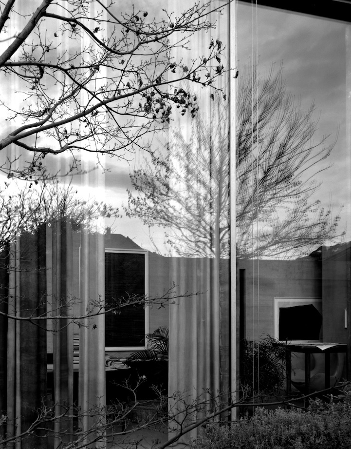 Black and white photo looking into the window of Atelier Peter Zumthor, in Switzerland